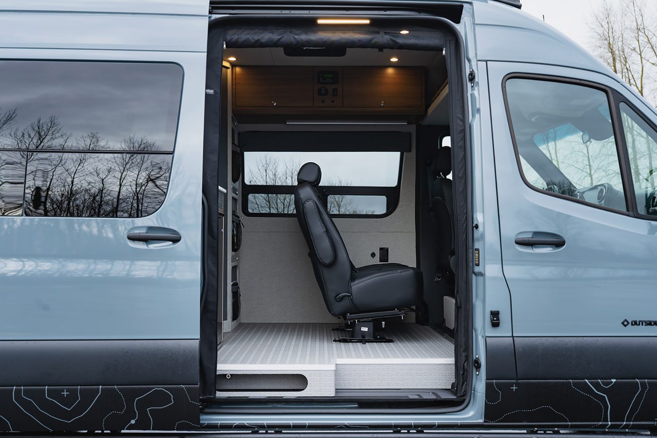 Open passenger-side slider door with removable captain's chairs
