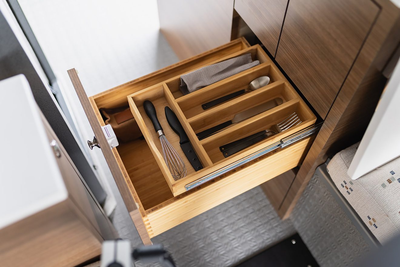 Galley kitchen storage drawer internal utensil holder