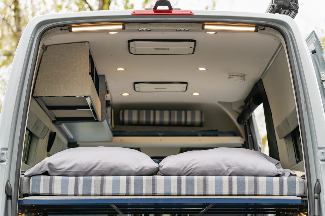 custom van conversion nor’easter 2021 mercedes benz sprinter 144 4wd seat two sleep three rear garage raised upper bed panel
