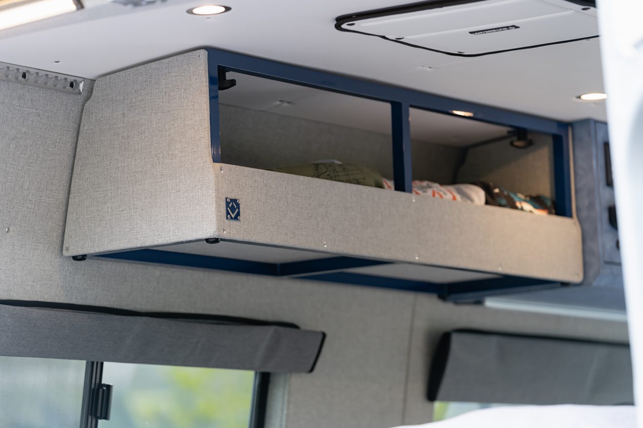 custom van conversion nor’easter 2021 mercedes benz sprinter 144 4wd seat two sleep three overhead exoskeleton cabinet