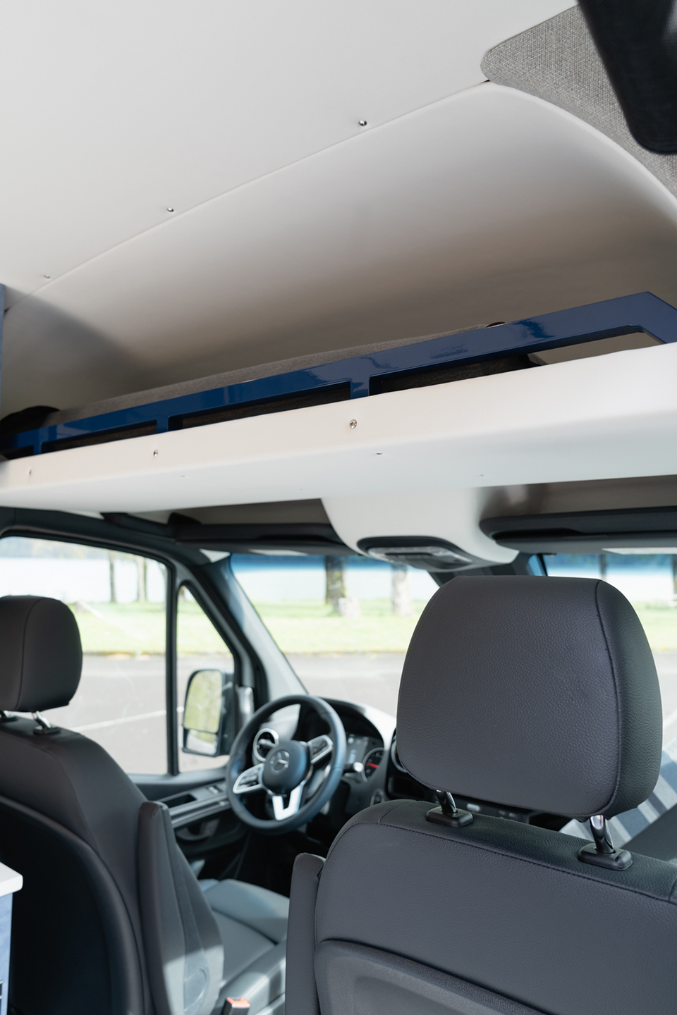 custom van conversion nor’easter 2021 mercedes benz sprinter 144 4wd seat two sleep three overhead cab shelf storage