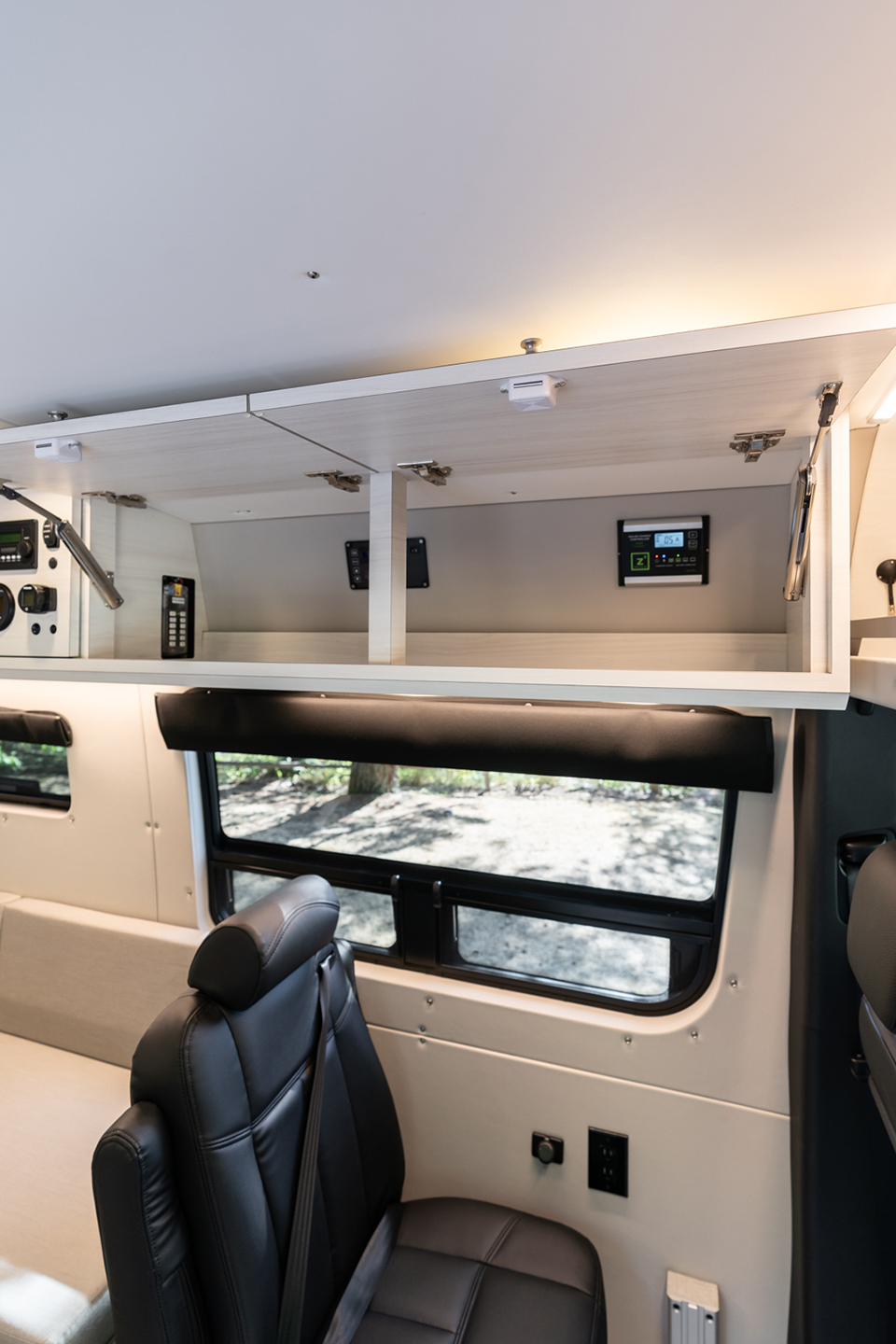 custom van conversion OBI 2022 mercedes benz sprinter 170 4wd seat three sleep three interior cabin overhead cabinetry