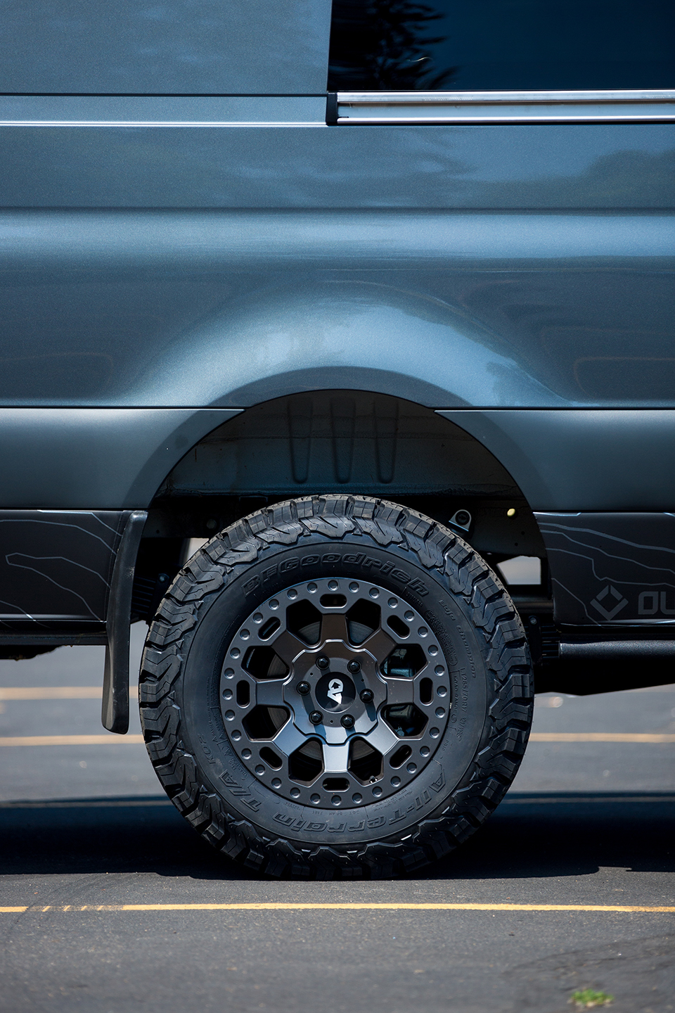 Detail of wheels and tires on custom off road sprinter van