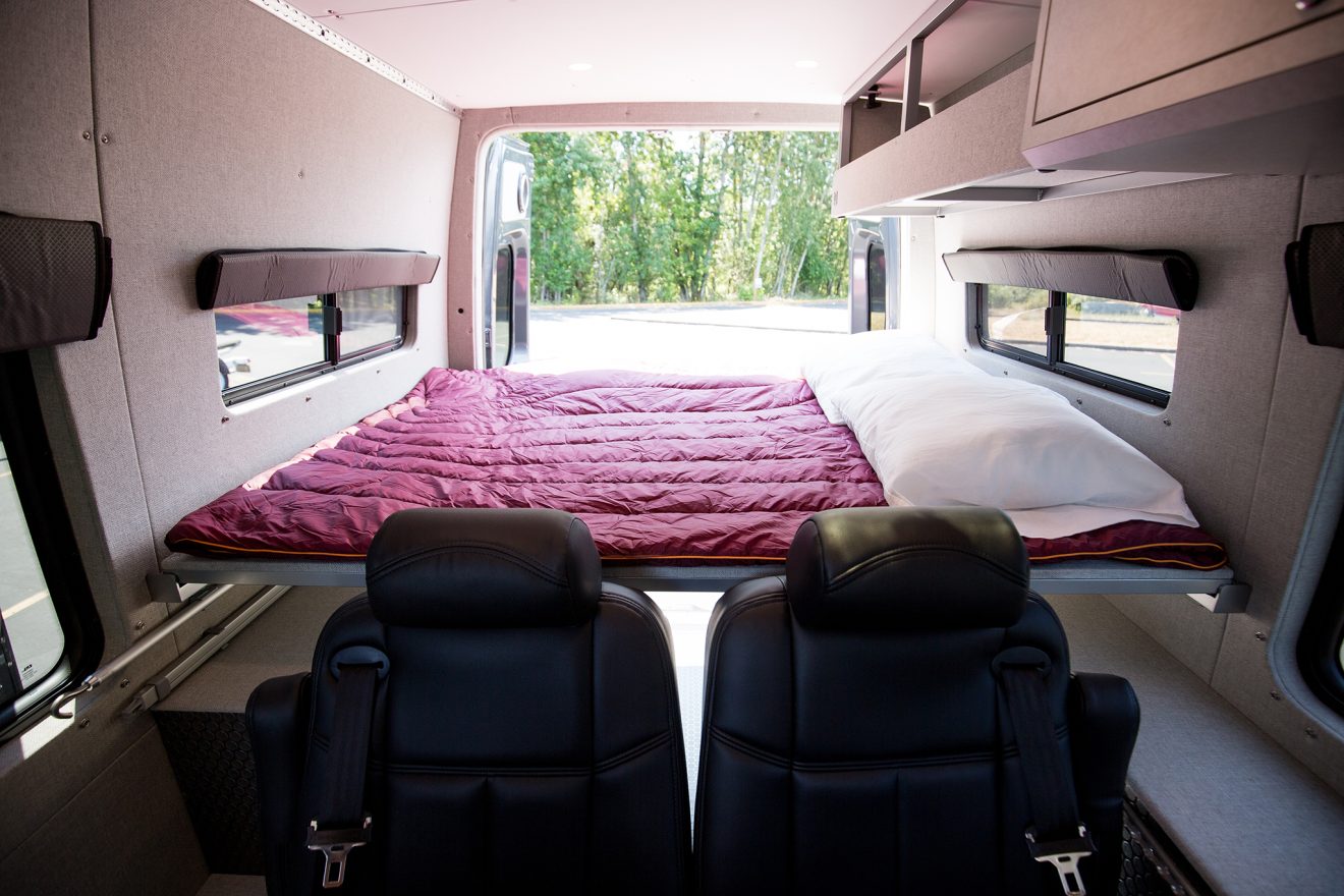 Detail of two panel bed inside custom off road sprinter van