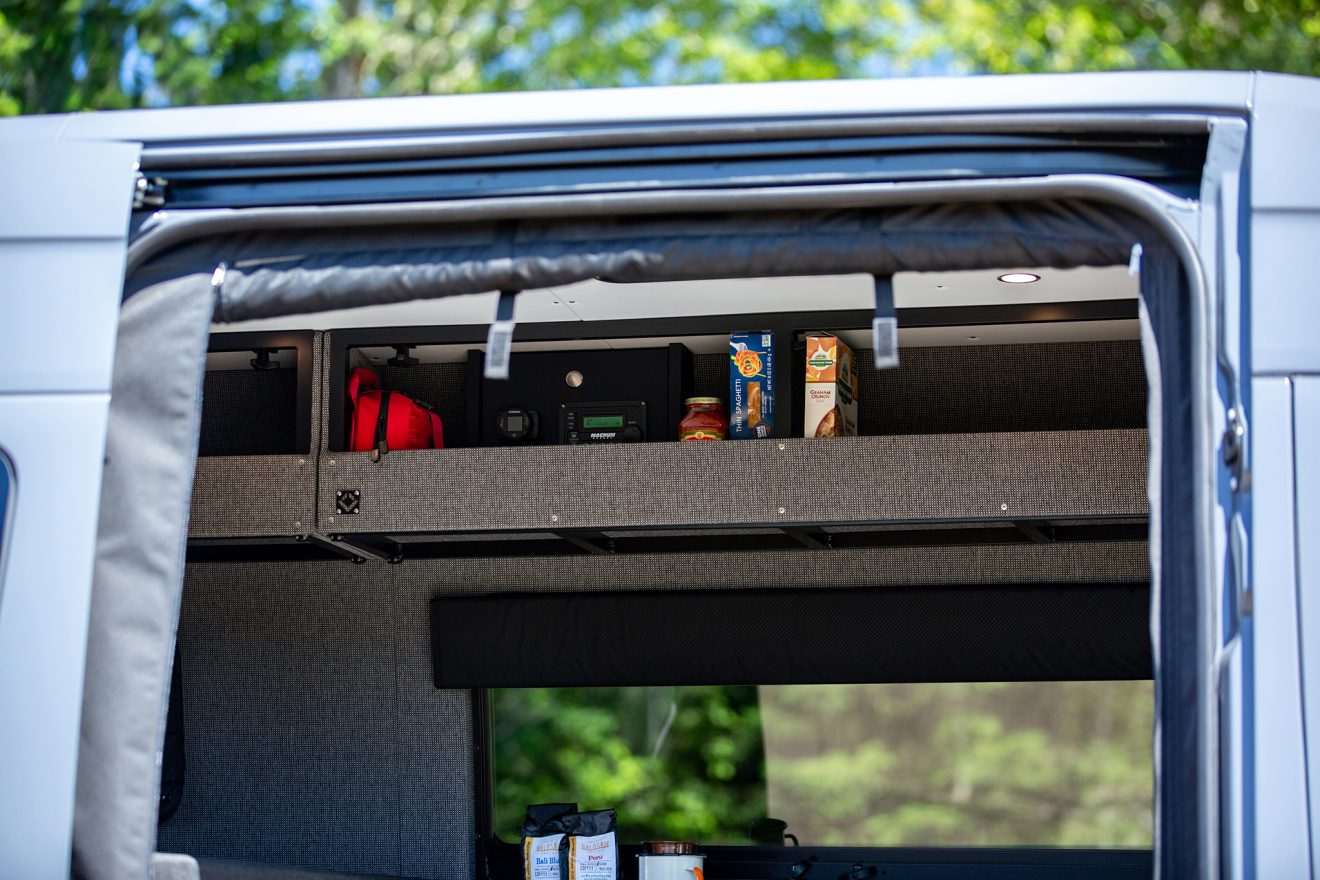Detail image of overhead cabinetry inside custom off road 144 sprinter van
