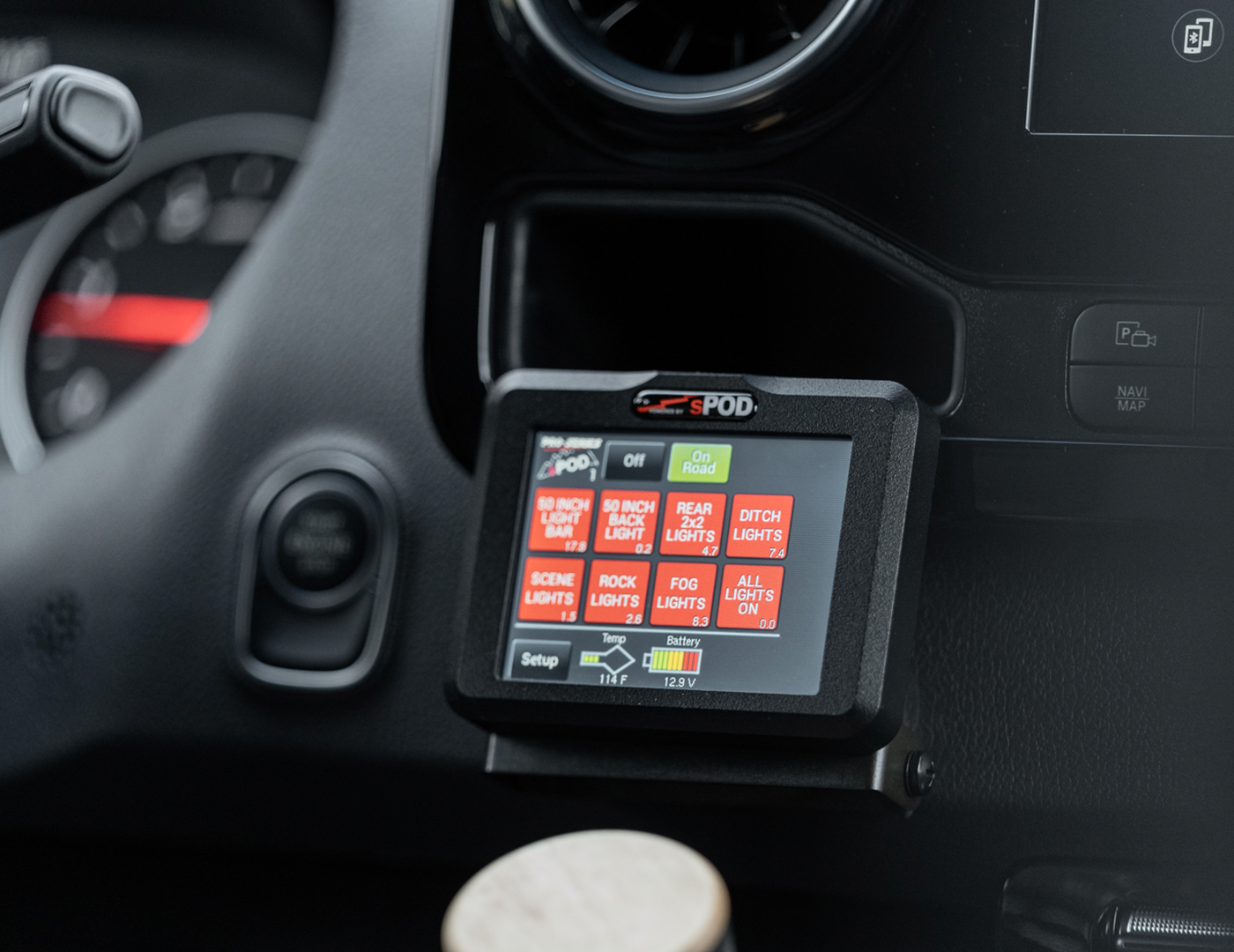 SPOD system navigation touch screen next to driver steering wheel