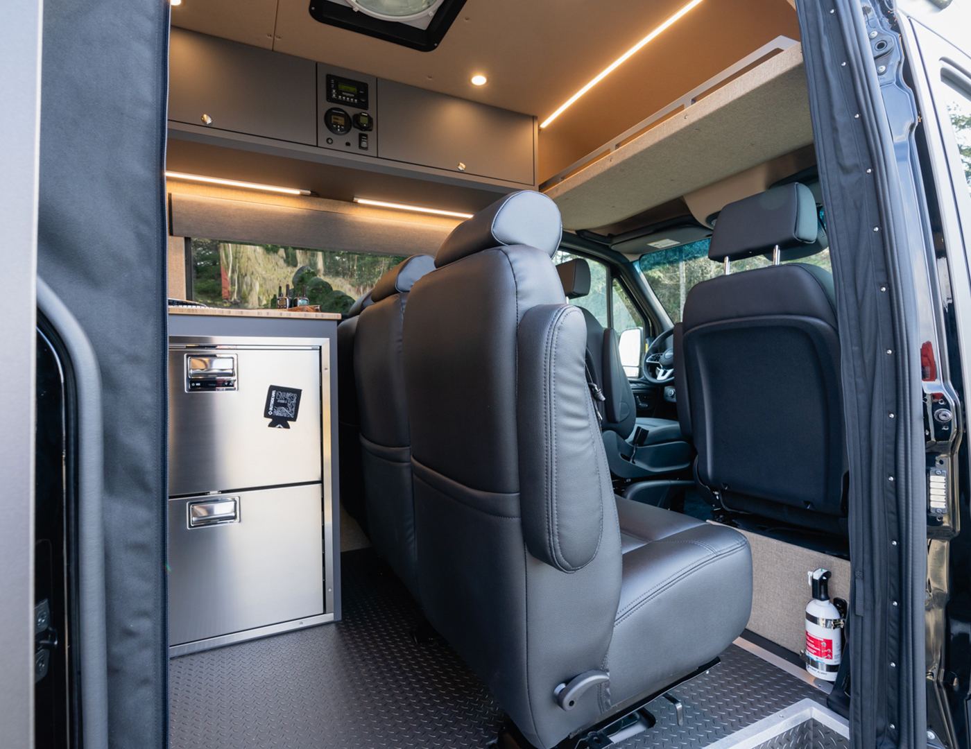 Sprinter 170 EXT open passenger slider door showing trave approved captain's chairs