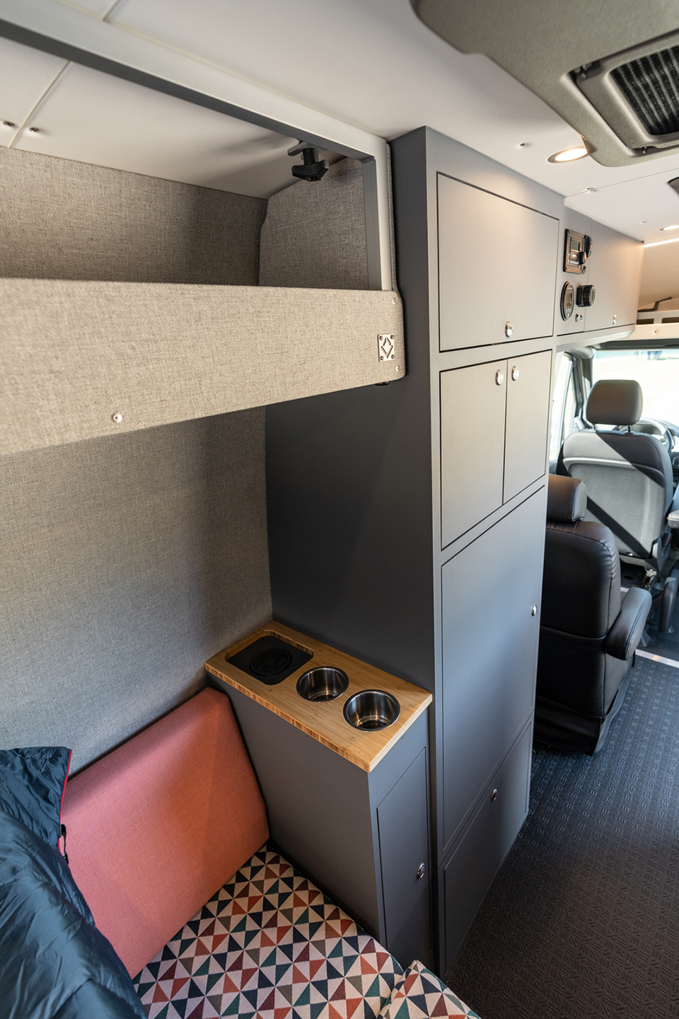 custom van conversion rucksack 2020 mercedes benz sprinter 170 4wd seat three sleep four interior storage cabinet overhead cabinetry