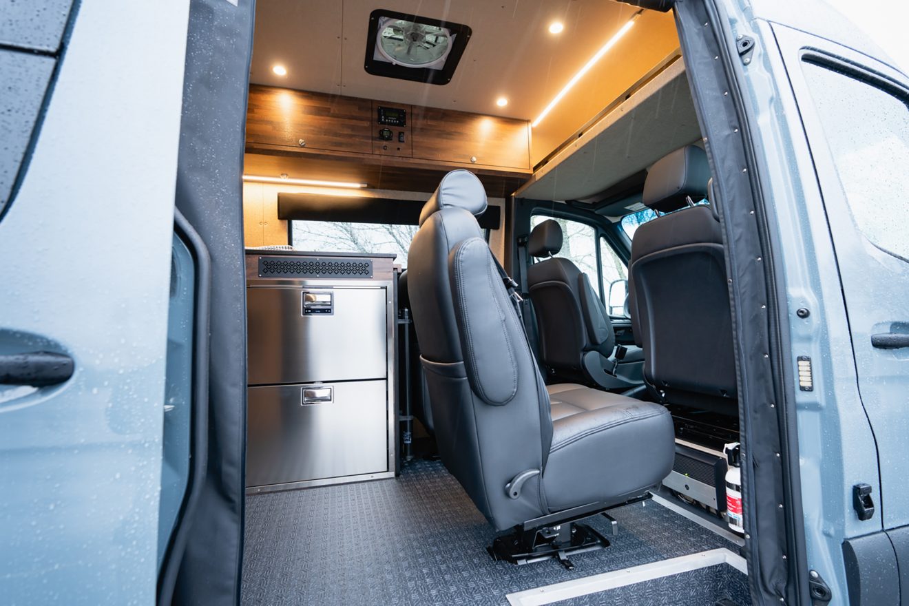 Interior passenger-side slider door open with removable captain's chairs