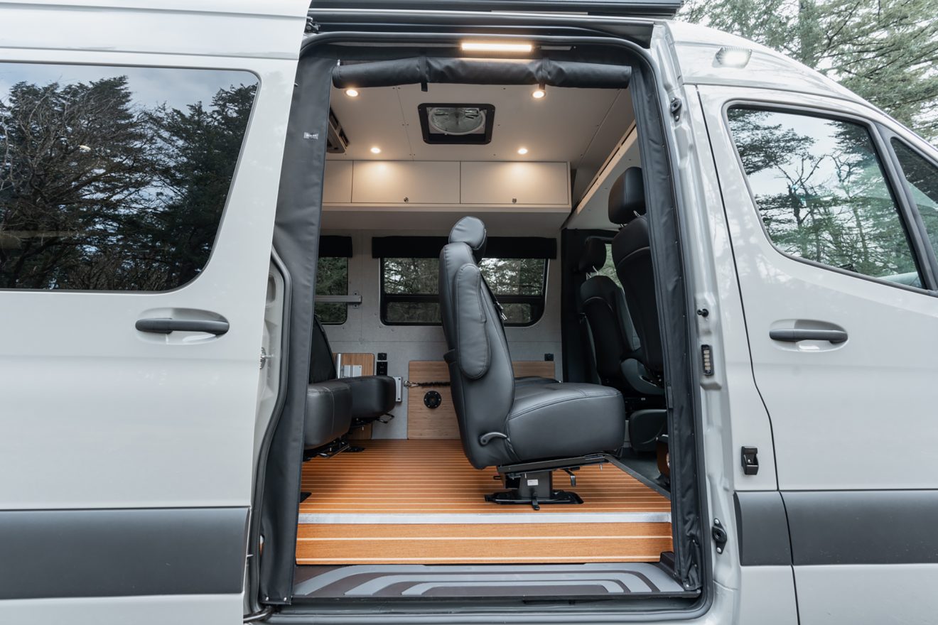 Passenger-side slider door open to four dot-approved captain's chairs