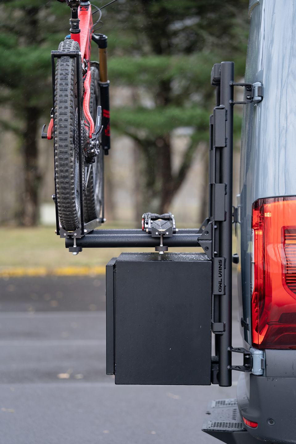 Rear Exterior blue van with owl medium cargo box and red bike on bike rack