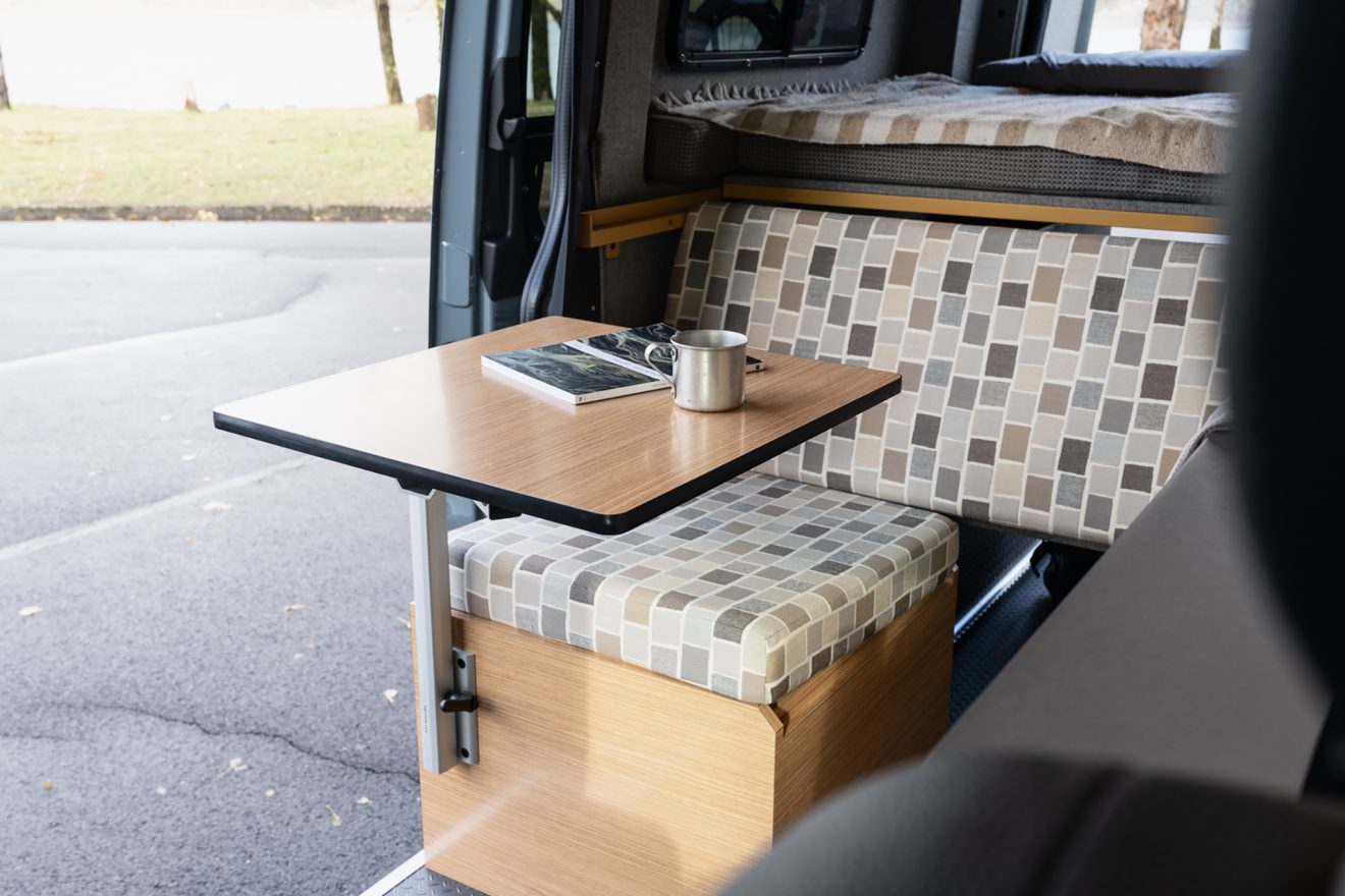 Interior van removable table and custom upholstered sofa seat