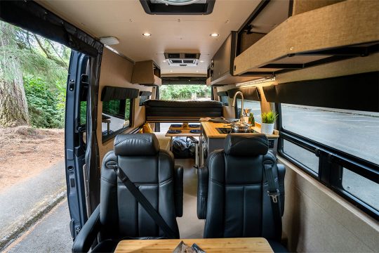 Interior of a 2020 Mercedes-Benz Sprinter 170 High Roof 4WD with seating for four and sleeping for two
