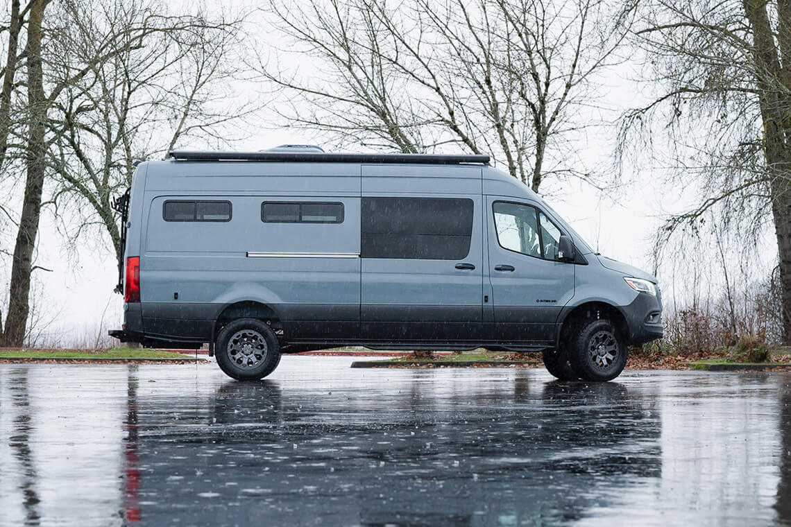 Blue van on wave pavement during a rainy day