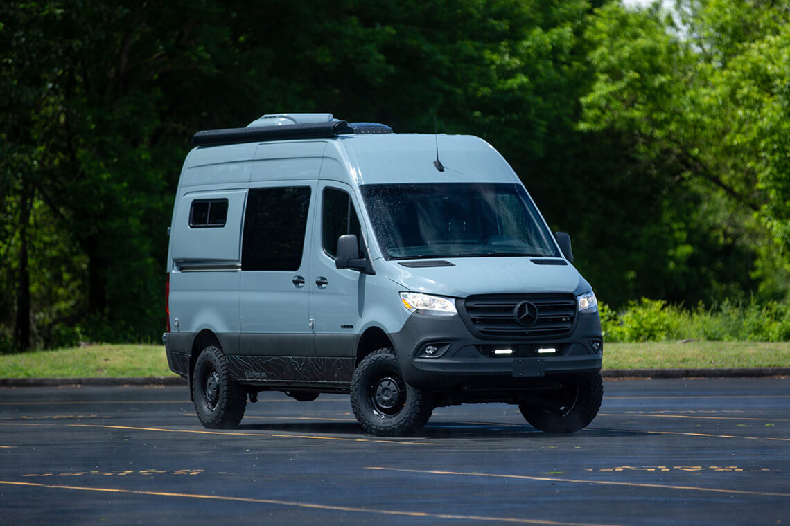 Custom Off Road Sprinter van in parking lot on sunny day