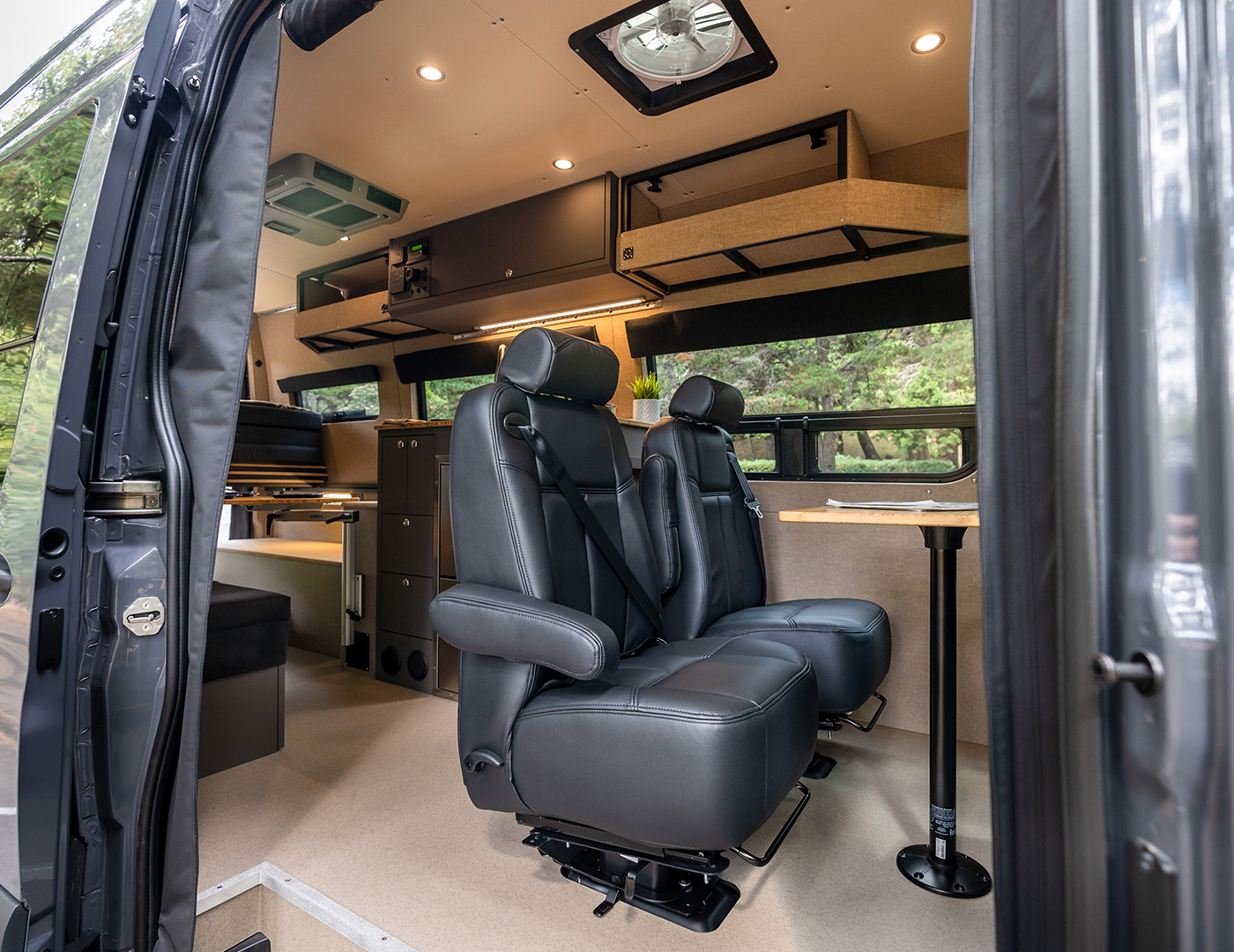 Interior of a 2020 Mercedes-Benz Sprinter 170 High Roof 4WD with seating for four and sleeping for two