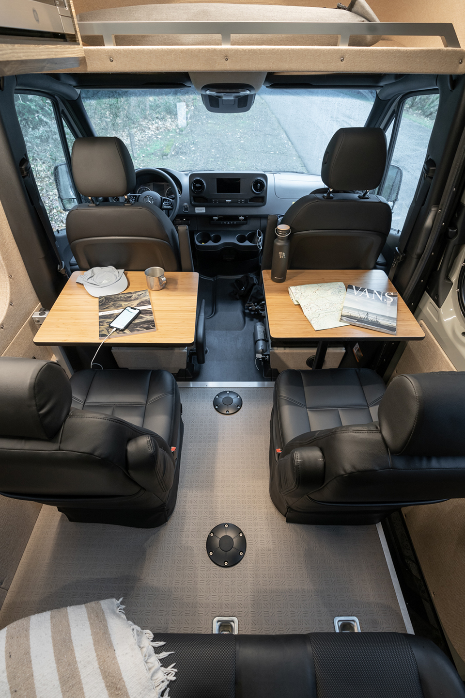 Two removable tables, two dot-approved captain's chairs, and one three-person bench seat