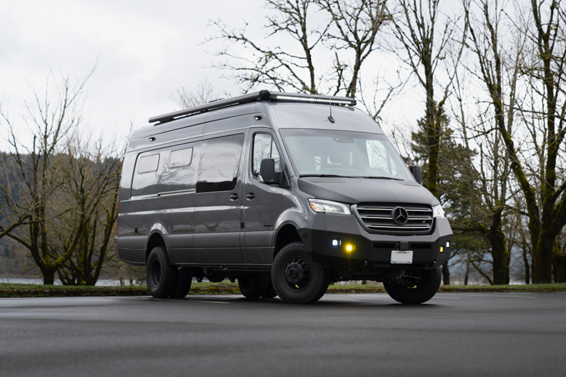 Custom off road mercedes Benz Sprinter with black hood wrap lift and awning