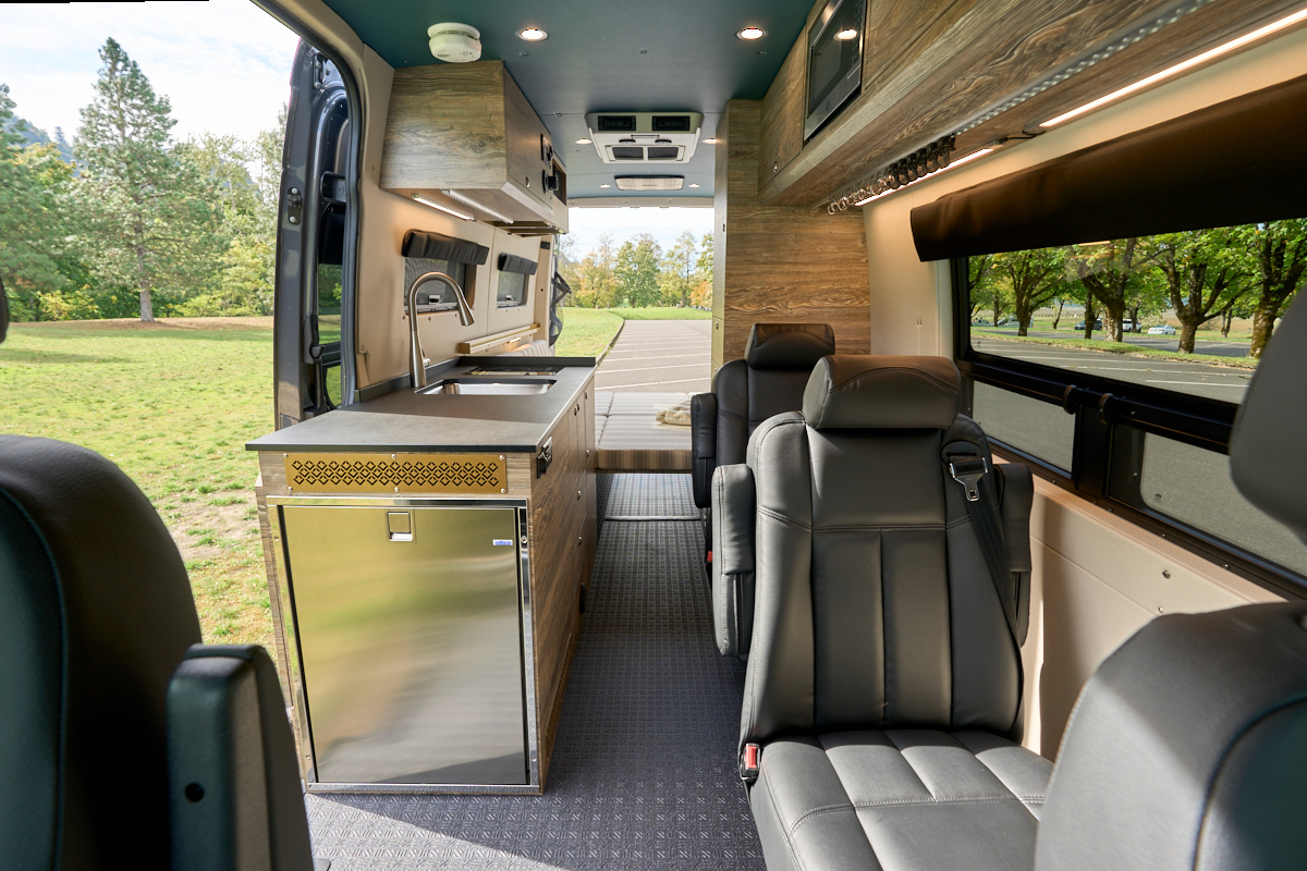 Foxglove is a custom converted 170 Mercedes Sprinter van by Outside Van with seating and sleeping for four
