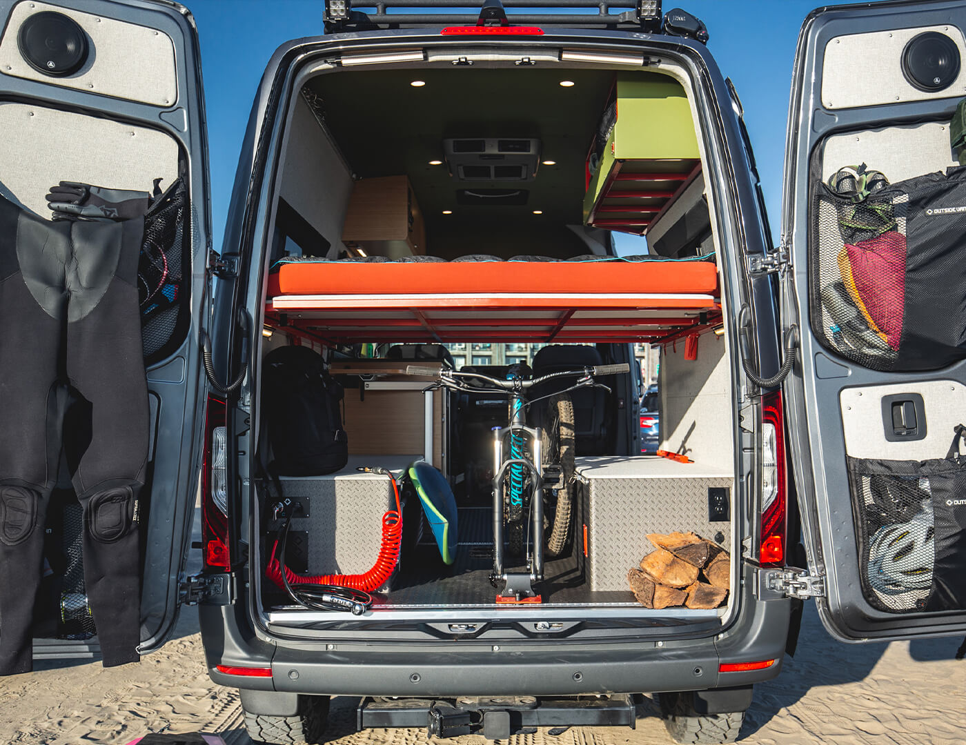 custom mattress that lets you sleep after surfing and mountain biking the custom built sprinter outside van