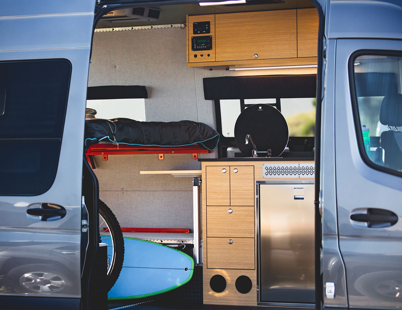 full kitchen and galley to take in your custom surf van that was built by outside van with full 4X4