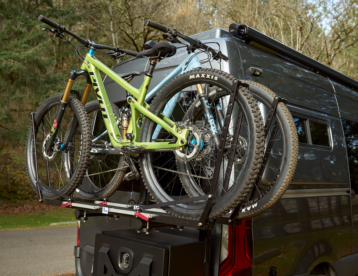 Beta by Outside Van is a custom built Mercedes 144 sprinter with kitchen, enclosed shower, seating for three, and external racks for two mountain bikes