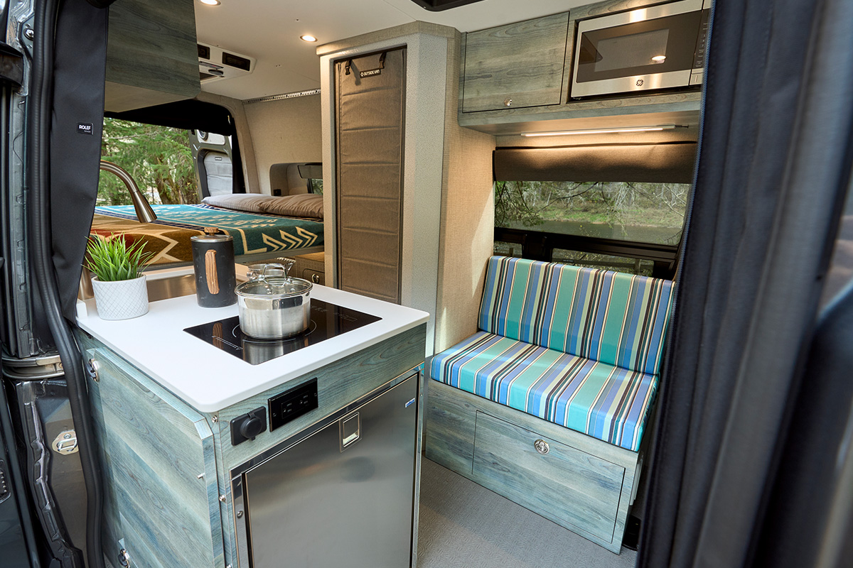Beta by Outside Van is a custom built Mercedes 144 sprinter with kitchen, enclosed shower, and seating for three