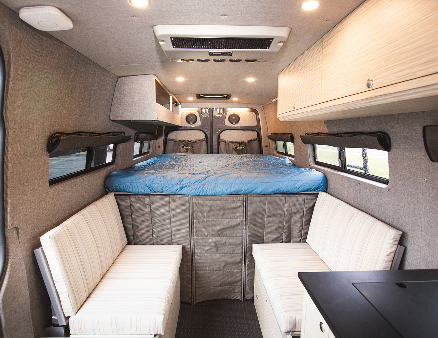 this 170" Ouside van, WyEast is seating and sleeping for 2 with a full galley and exterior shower